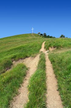 footpath and cross in Antola mount, Liguria, Italy