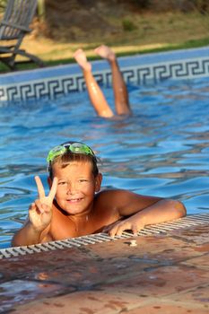 Tropical Scene with swimming pool and kids