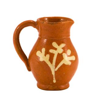 Retro clay pitcher brown color object with handle and ornaments isolated on white background. Home handmade decoration.
