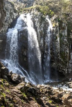 Landscape with vernal waterfall in sunny day