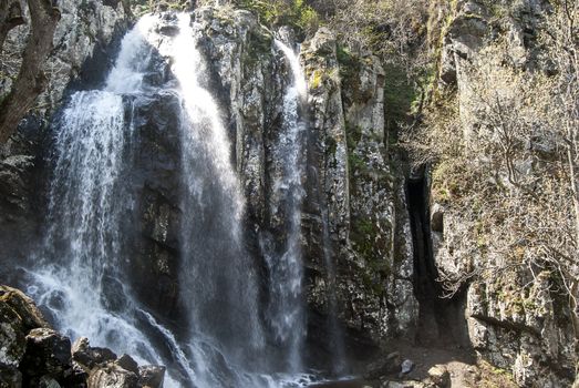 Landscape with vernal waterfall in sunny day