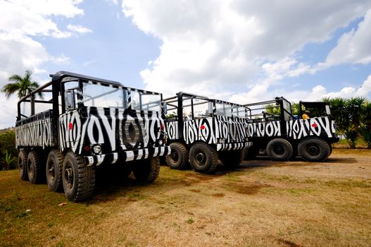 Empty safari trucks waiting for tourists