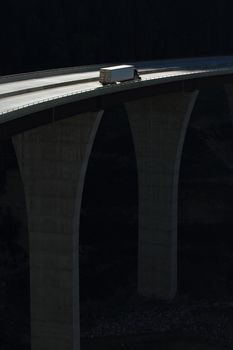 Semi-trailer truck crossing a high level bridge in British Columbia