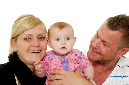 Happy family. Mother and father are looking at their sweet smiling 4 month old baby.