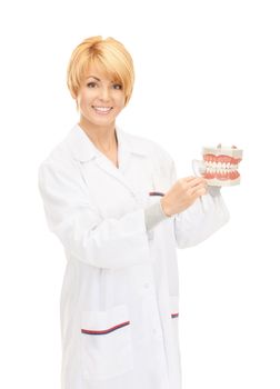 picture of attractive female doctor with toothbrush and jaws