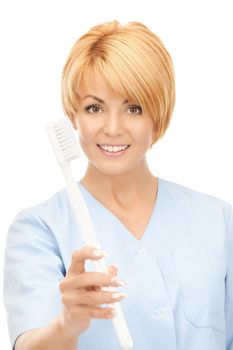 picture of attractive female doctor with toothbrush