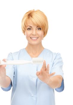 picture of attractive female doctor with toothbrush