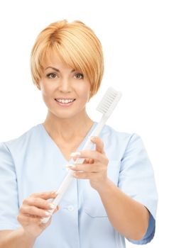 picture of attractive female doctor with toothbrush