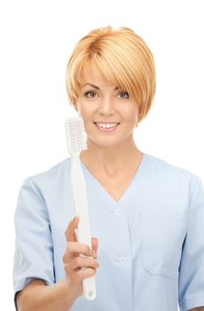 picture of attractive female doctor with toothbrush