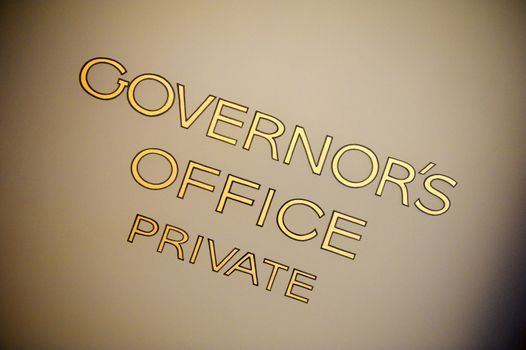 Old, hand painted lettering on the governor's door marked as private