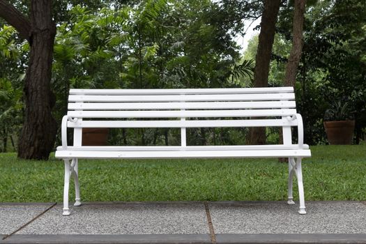 Close up white chair in the garden.