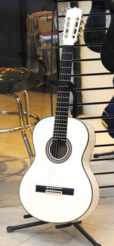 Acoustic six strings guitar in a musical shop