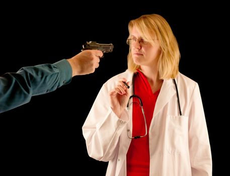 A person hold the doctor at gunpoint