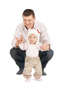 picture of baby making first steps with father help