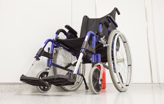 Wheel chair in hospital corridor