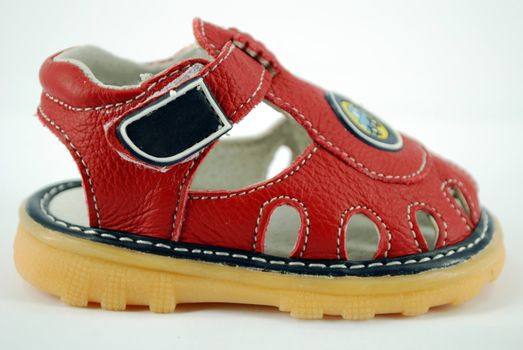 Children red sandal on white