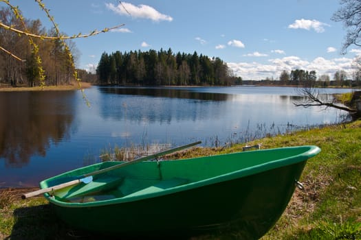 Idyllic rowing boat on a lake in the latvia
