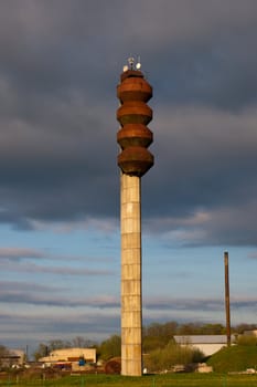 Old big rusty water tower in contryside