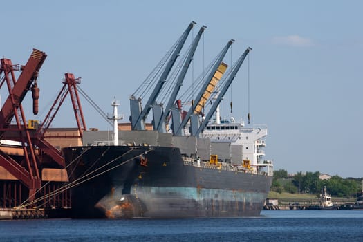 Big dry cargo ship at pier in Harbor 