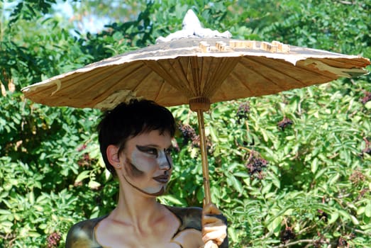 Girl with sunshade portrait face paint