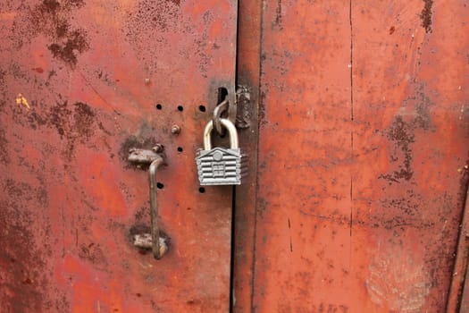 padlock on the rusty door