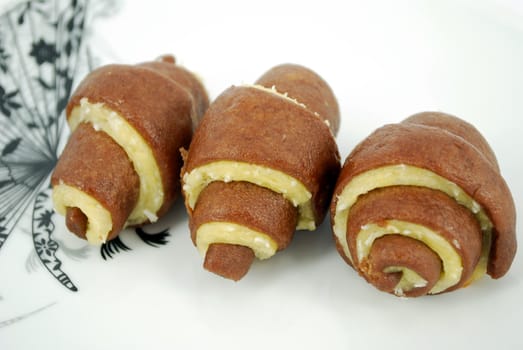 Sweet coconut roll cookie on dish