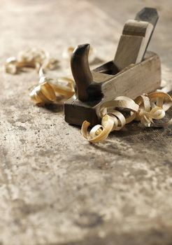 Wood planer and shavings at carpenters workshop