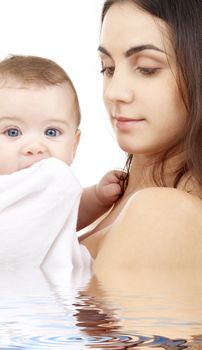 picture of happy mother with baby in water (focus on mother)