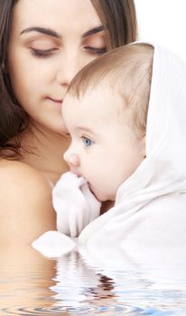 picture of happy mother with baby in water (focus on mother)