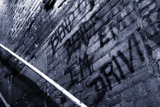 Old stair case brick wall with graffitis