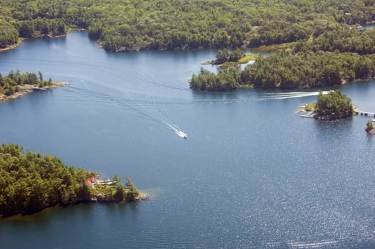 Islands and sounds on surface of water in sunlit