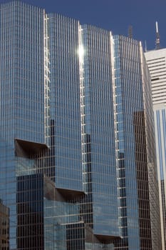 glass wall of a high-rise building in downtown Toronto