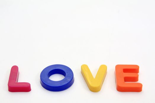 Word LOVE made from Plastic isolated over white background