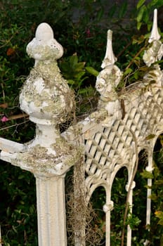 Over a century old iron fence painted white