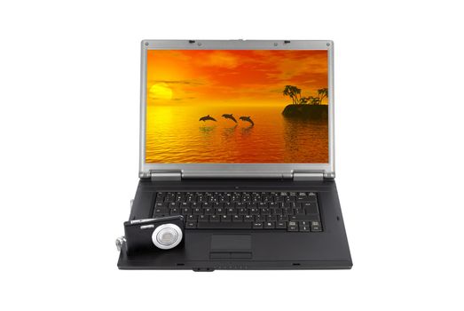 Laptop with camera and tropic scene on display