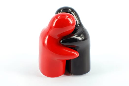 People red and black figure in hug