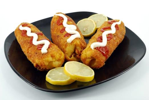 Fried salt pancake with lemon and ketchup