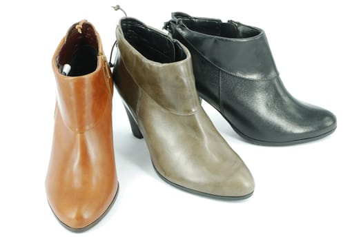 Woman short leather boots on white