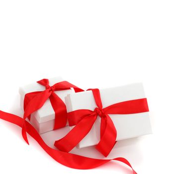 white gift with red ribbon