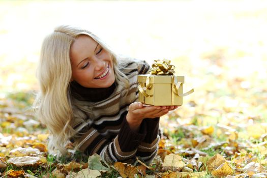 woman take autumn gift in park