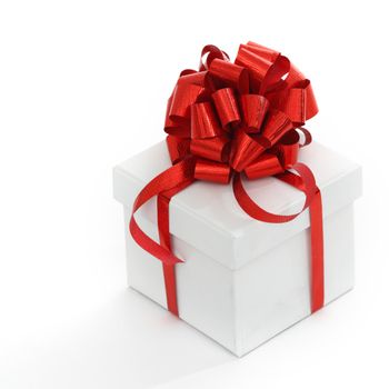 white christmas gift with red ribbon