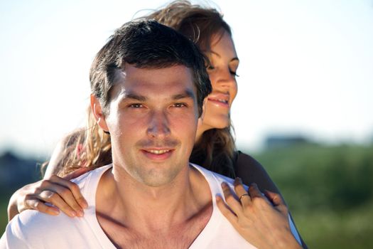 man and woman hug in the sky