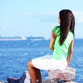 woman relax blue sea and bubbles on background