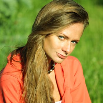 young sommer woman on green grass