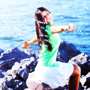 woman relax blue sea and bubbles on background