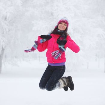 winter women jump in snow
