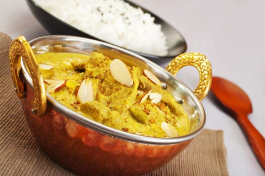 Lamb Pasanda, a rich Indian curry with thinly sliced lamb, spices, cream and almonds, with basmati rice.