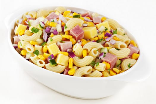 Macaroni salad with ham, cheese, corn, red onion and cucumber.