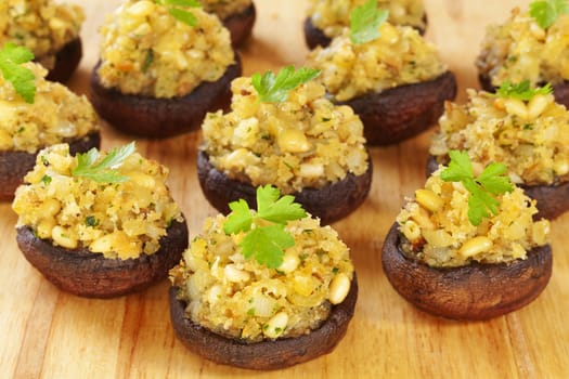 Portobello mushrooms stuffed with a mixture of pine nuts, onion, garlic and cheese.