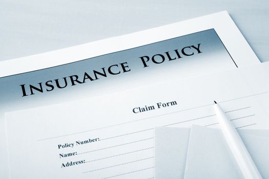 Insurance policy and claim form, focus on words "claim form".